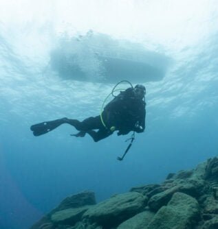 Diver under Diver's Club Crete Boat