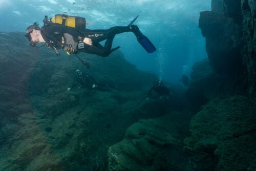Divers in Mononanftis underwater canyon