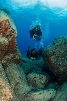 Divers Underwater Canyon